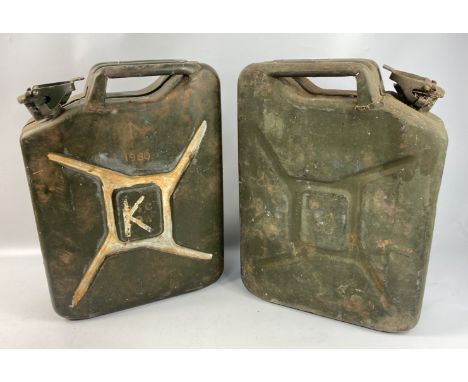 A pair of military jerry cans both carrying broad arrow military issued stamps. One stamped RTB CP&amp;F and the other BSC CP