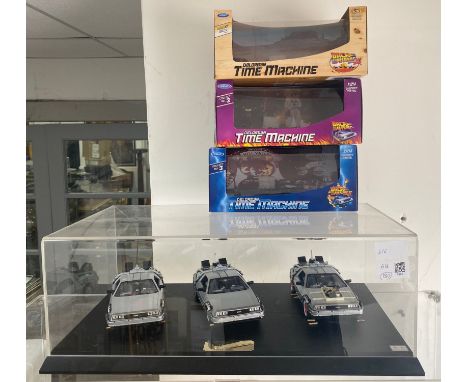 All 3 Welly 1/24 Scale Diecast Delorean Time Machine - Back To The Future in home made display with cases.  Original boxes su