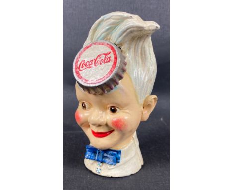 A vintage SPRITE BOY COCA COLA cast iron money box standing 21cm tall, some chips to paintwork on headApprox 1 pieces