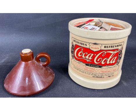 A ceramic COCA COLA cookie jar full of match books (26x50cm)Approx 1 pieces