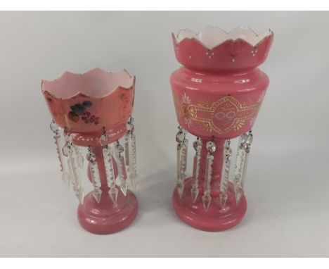 Two vintage pink glass mantle lustres complete with all suspended droplets 36 and 29cm tallApprox 2 pieces