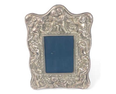ART NOUVEAU inspired A silver photo frame decorated with cherubs, hallmarked Sheffield 1987, 19x14cm, approx, gross weight 29