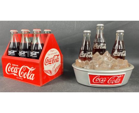 A quantity of COCA COLA advertising wares to include 6 coke bottles in a bottle rack and 3 bottles in a light-up ice bucket,A