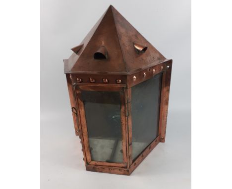 An attractive copper lantern with 3 glass panels which can be either free-standing or wall-mounted, height approx 44cm, width