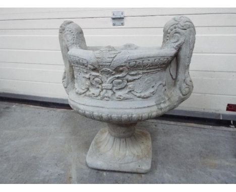 Garden Stoneware - A large reconstituted stone two handled decorative urn planter in two pieces 