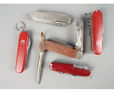 A vintage riggers knife with marlin spike, marked 1942 and blade stamped NKF and a quantity of multi tool knives including tw