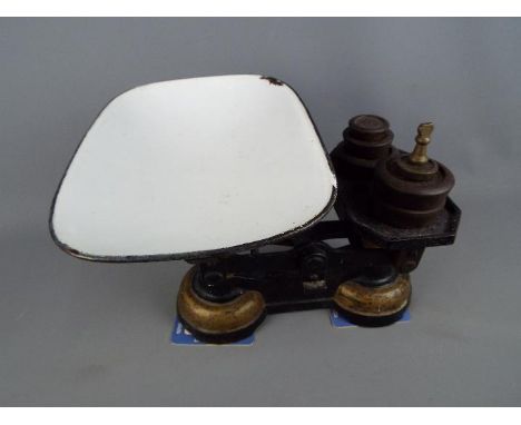 A set of vintage scales and weights.