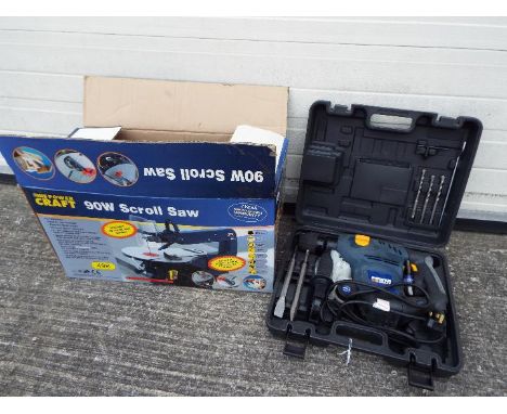 A boxed Powercraft 90W Scroll Saw and a Powercraft SDS and Rotary Hammer Drill in case. [2]