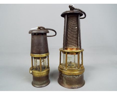Two safety lamps to include a Wolf Safety Lamp Co Baby Wolf Lamp and one other stamped 'Cornilagilly' 308, largest approximat
