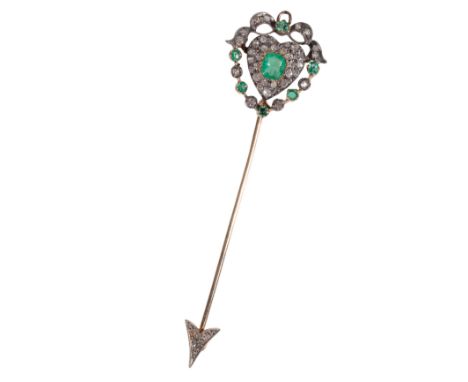 AN EMERALD AND DIAMOND-SET JABOT PIN the central emerald and diamond heart cluster, within an openwork wreath of emeralds and