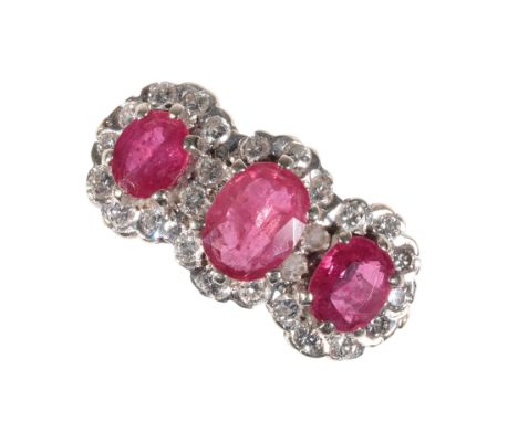 A 'RUBY' AND DIAMOND RING three oval-cut synthetic rubies claw-set each within a border of diamonds on an 18ct yellow gold ha