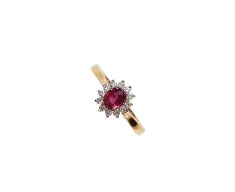 A DIAMOND AND RUBY CLUSTER RING on an 18ct yellow gold shank, ring size O