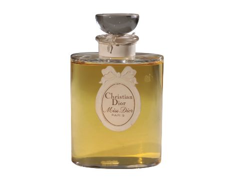 CHRISTIAN DIOR: A LARGE 'MISS DIOR' SCENT BOTTLE apparently still sealed, 32 fl oz., 21cm high