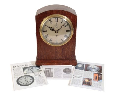 AIR MINISTRY MANTEL CLOCK in oak case, the silver dial with RAF emblem, black Roman numerals and dark blue steel hands, RAF n