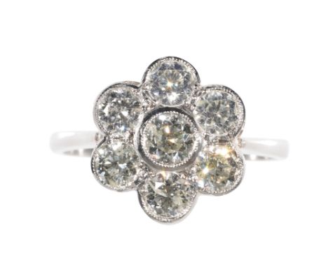 A DIAMOND CLUSTER RING seven collet-set diamonds, forming a flower head, approx 1.50ct total weight, on a platinum shank, rin