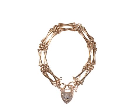 A 9CT YELLOW GOLD GATE LINK BRACELET with padlock clasp and safety chain, approx 11grams