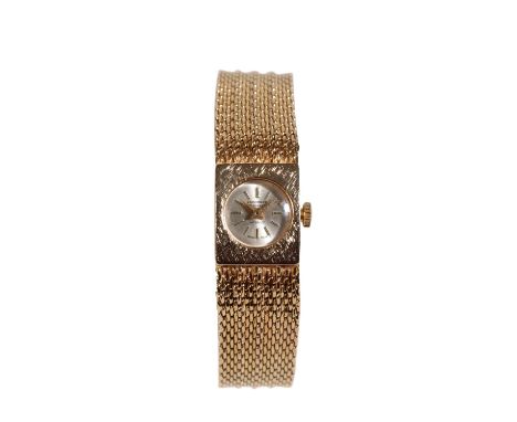 CARRONADE LADY'S 9CT GOLD BRACELET WRISTWATCH with manual wind movement, the silver dial with gold baton numerals and hands, 