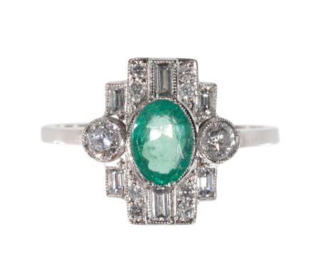 AN  ART DECO STYLE EMERALD AND DIAMOND RING the oval-cut emerald, within a border of round and baguette cut diamonds, on a pl