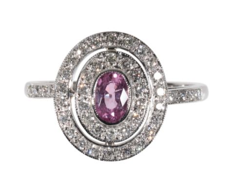 A PINK SAPPHIRE AND DIAMOND TARGET RING the pink sapphire approx 0.50ct, surrounded by a double row of brilliant-cut diamonds