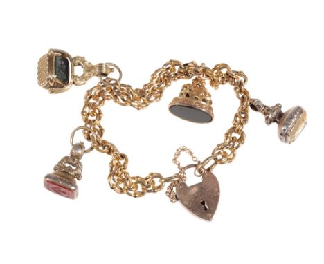 A 15 CT GOLD CHAIN LINK CHARM BRACELET with four attached&nbsp; fobs, one with an amethyst engraved with a lions head in prof