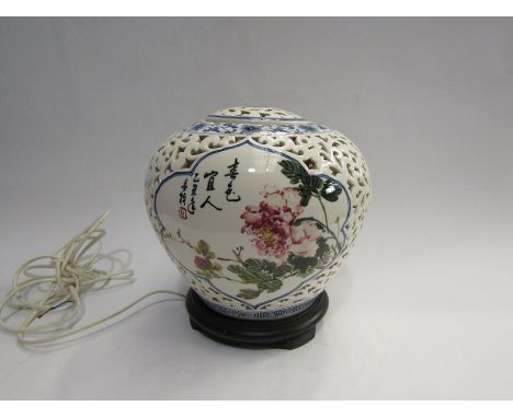 A Chinese bulbous body table lamp with pierced design, on stand, 22cm tall