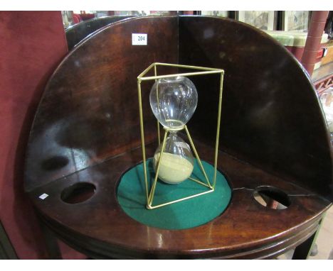 A modern sand timer, 23cm tall
