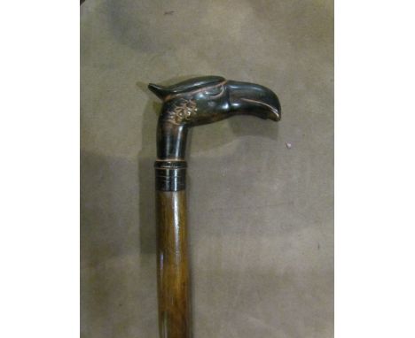 A walking stick with cast handle in the form of an eagle's head, 93.5cm tall