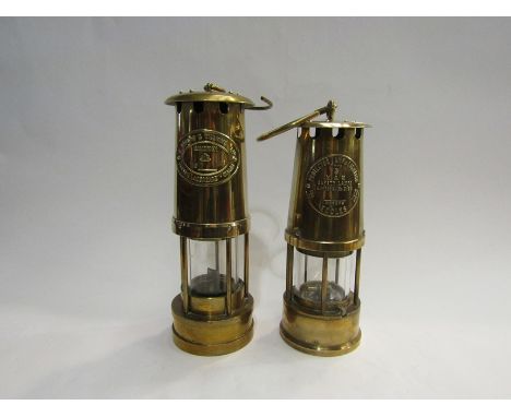 Two brass miner's lamps; E. Thomas &amp; Williams Ltd, Cabrian No. 76040 and Protector lamp type 6 M &amp; Q, Eccles