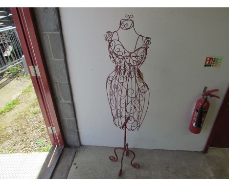 A red wirework floor-standing mannequin, 154cm tall