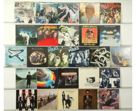 A collection of 24 Classic Rock/New Wave/Glam Rock/Pop LPs to include artists; Blondie, Elvis Costello, The Rolling Stones, G