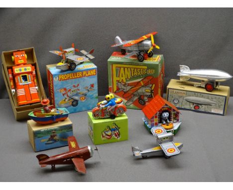 VINTAGE TYPE CLOCKWORK TIN PLATE TOYS (9) including aeroplanes, a Los Angeles Zeppelin and a chief robot