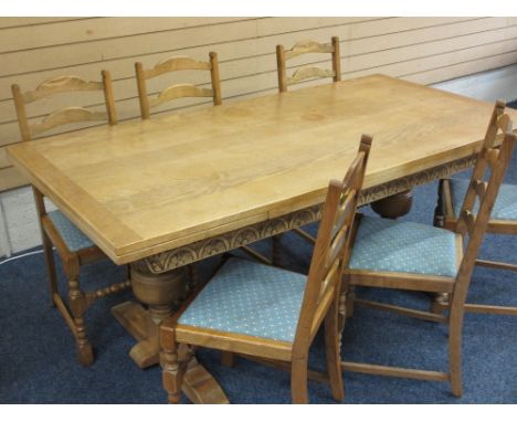 EXCELLENT LIGHT OAK DRAW LEAF REFECTORY TABLE and six ladder back dining chairs, the table having carved frieze detail on sub