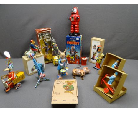 VINTAGE TYPE CLOCKWORK TIN PLATE TOYS (10) including circus and fairground and a boxed mechanical planet robot