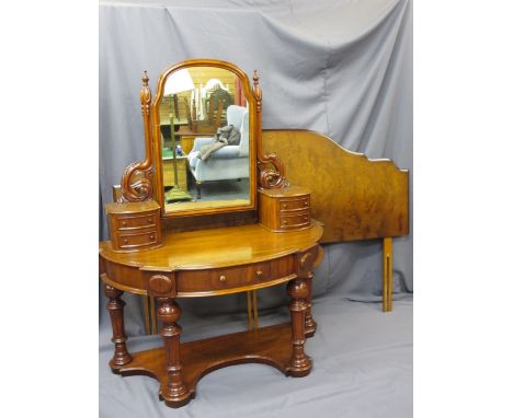 VICTORIAN MAHOGANY DUCHESS DRESSING TABLE having central shaped mirror on carved supports with twin, two drawer bases on a sh