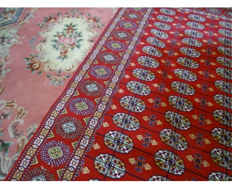 MODERN IRANIAN SILK CARPET - red ground with repeating central pattern and triple bordered edge, 275 x 182cms along with a pi