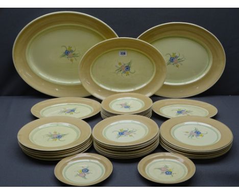 CLARICE CLIFF - FOR WILKINSON POTTERY DINNER &amp; TABLE PLATES to include five oval platters, 12 x 25.5cms dinner plates, 9 