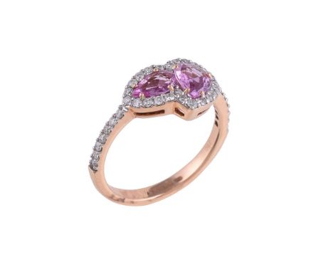 
	
		A pink sapphire and diamond Beneath The Rose ring by William &amp; Son, the two pear cut pink sapphires within a surroun