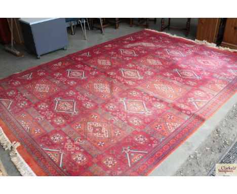 A modern red patterned carpet (some wear)