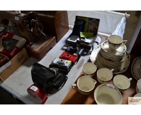 A quantity of cameras and an alarm clock