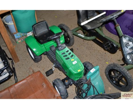 A small child's pedal tractor