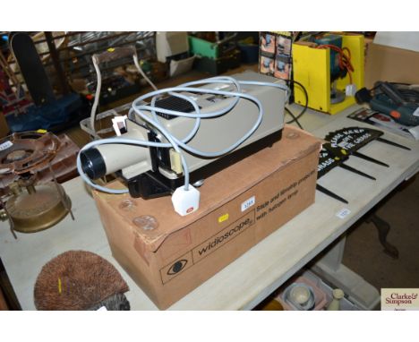 A Widioscope slide and film strip projector with halogen lamp 