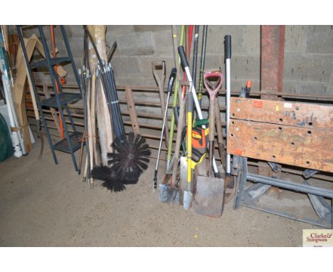 A quantity long handled garden tools