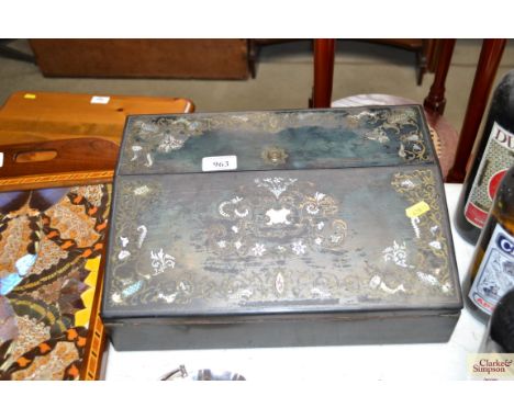 An ebonised brass and mother of pearl inlaid writing box