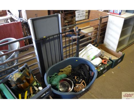 A stair gate; a dog ramp; a dog basket and dog related items 