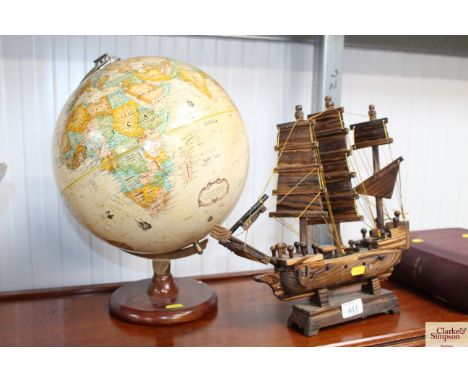 A globe and a wooden ship