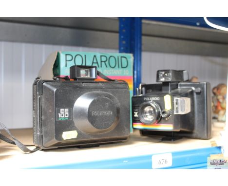 Two Polaroid cameras 