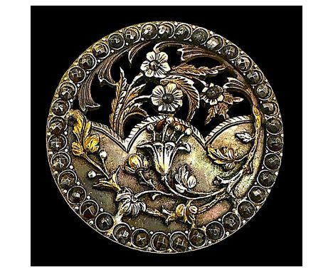 1 Large 19th century brass-cut steel-pearl button. This great button is one of three designs made like this that we know of. 
