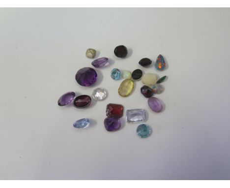 A Selection of Loose Gemstones including opals and amethyst 