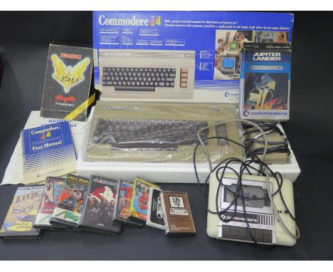 A Commodore 64 Computer Boxed with Manual with C2N Cassette and Games. (items not tested). 