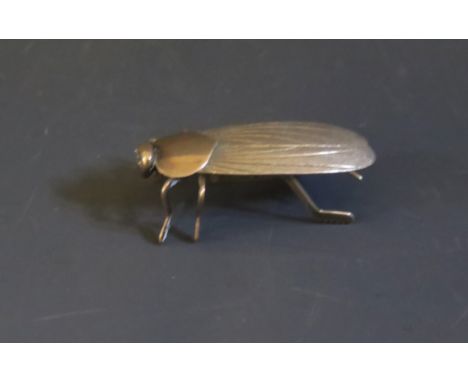 A Chinese Silver Bug, marked to the underside of the tail, 54mm long, 139 